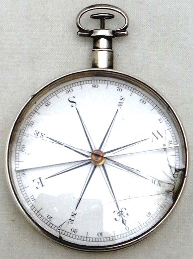 Appraisal: A pocket compass the enamelled dial with black numerals and