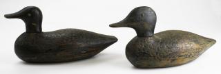 Appraisal: Pair Quebec primitive tack eye decoys with feather carving Pair