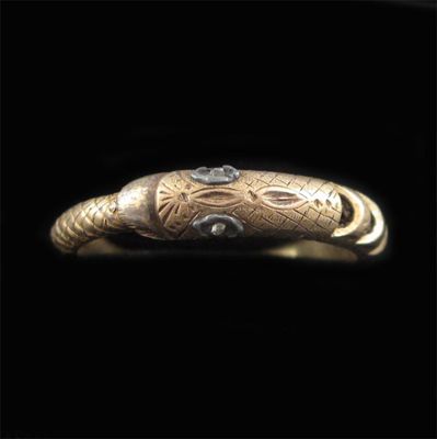 Appraisal: A nineteenth century snake ring realistically formed with diamond eyes