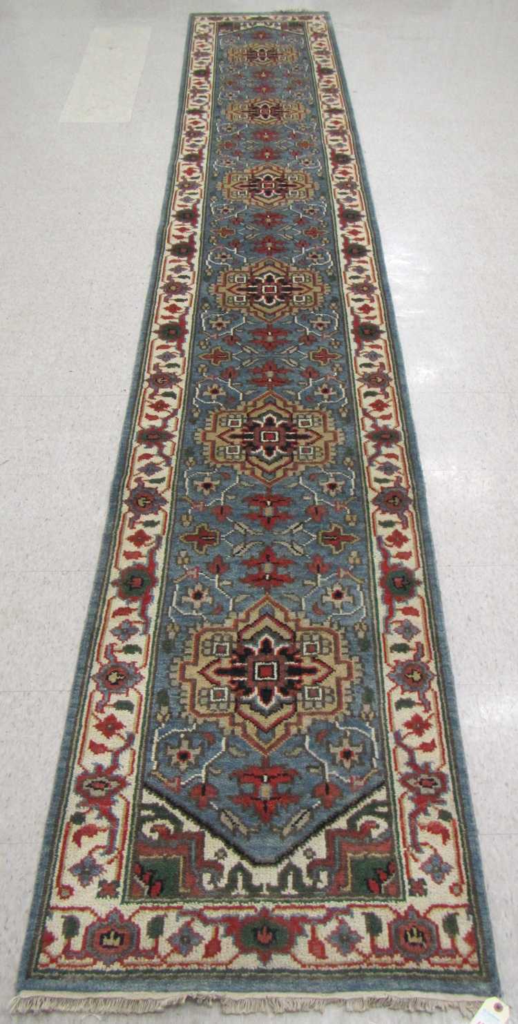 Appraisal: HAND KNOTTED ORIENTAL RUNNER Indo-Persian six geometric medallion and stylized