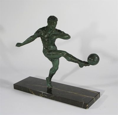 Appraisal: A Verdi Gris figure of a footballer cast from a