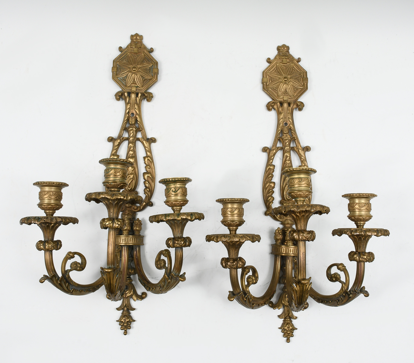 Appraisal: PAIR OF ANTIQUE LIGHT GILT BRONZE SCONCES Surmounting floral medallion