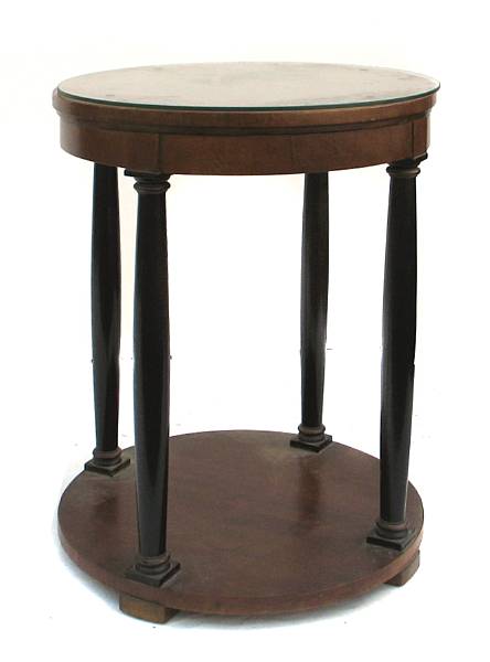 Appraisal: An Empire style parcel ebonized two tiered circular table height