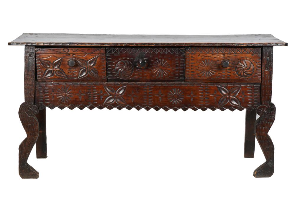 Appraisal: INDONESIAN STYLE CARVED INCISED MOTIF SERVERwith three apron drawers above