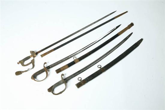 Appraisal: THREE SWORDS Nineteenth century All have brass guards and leather