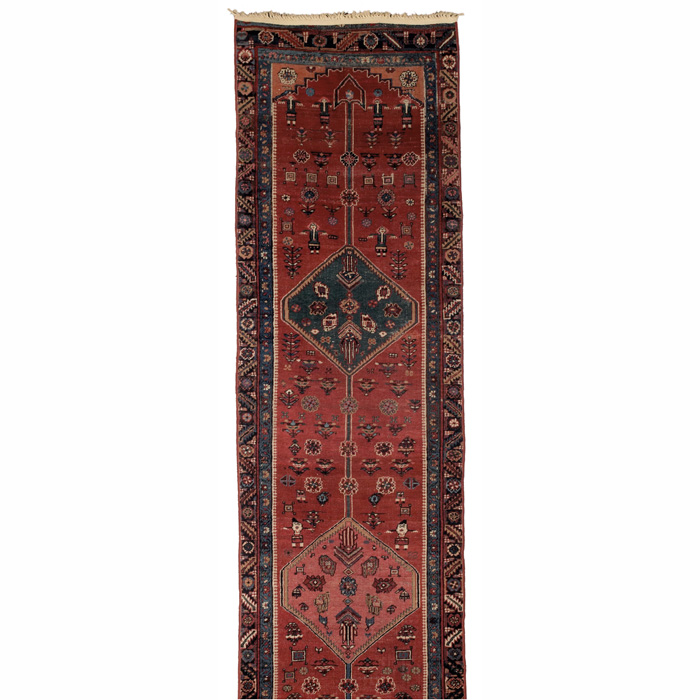 Appraisal: Caucasian runner c stylized floral design on a red field