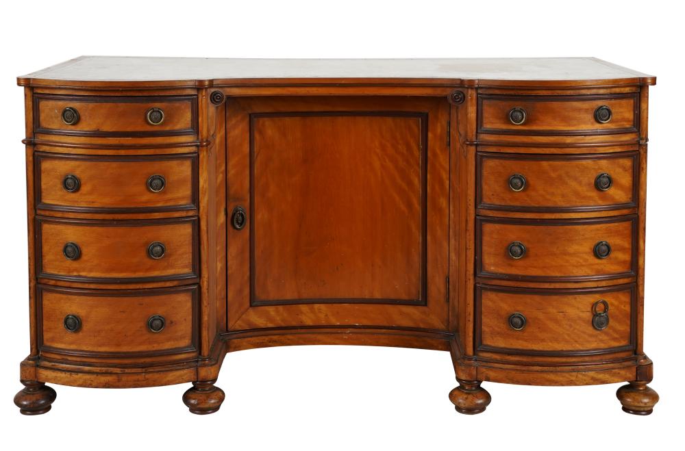 Appraisal: EDWARDIAN MAHOGANY DESKthe serpentine case with white leather-inset top having