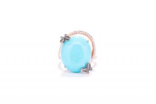 Appraisal: A TURQUOISE AND DIAMOND RING Large center turquoise has a