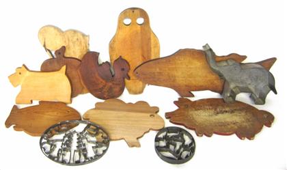 Appraisal: Collection of shaped wooden cutting boards and tin cookie cutters