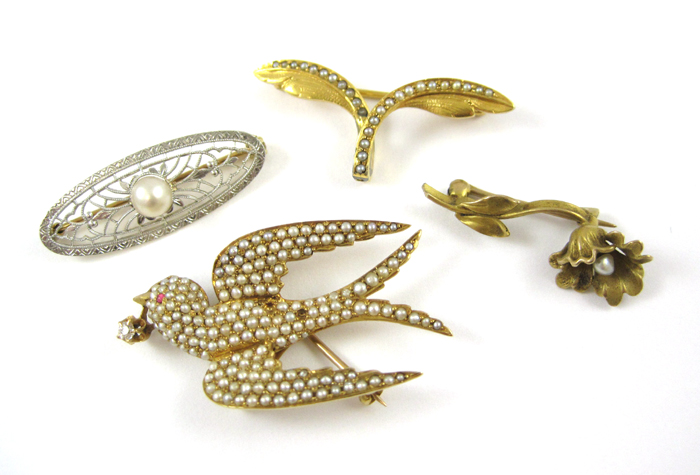 Appraisal: COLLECTION OF FOUR FOURTEEN KARAT GOLD PINS including a yellow