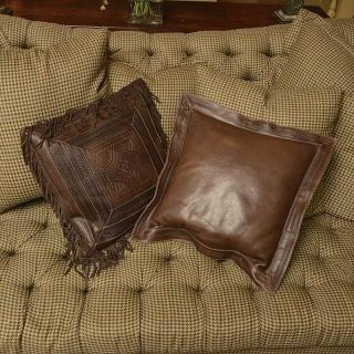 Appraisal: Ralph Lauren tooled leather throw pillows Ralph Lauren tooled leather