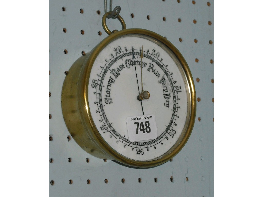 Appraisal: Brass circular barometer the white ceramic dial within a drumhead