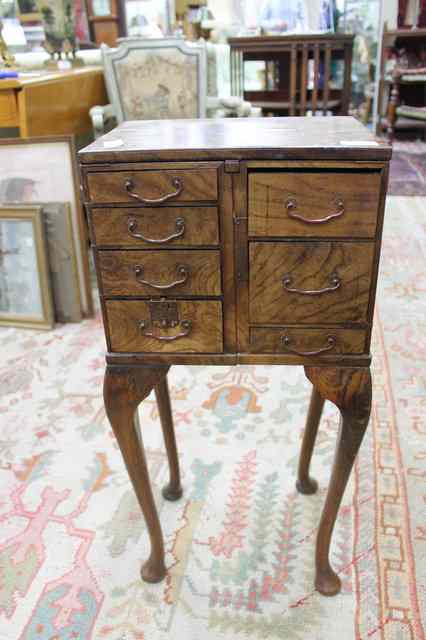 Appraisal: AN ORIENTAL ELM AND OAK OCCASIONAL TABLE with a series