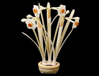 Appraisal: CARVED AND POLYCHROMED IVORY ORCHIDS IN A PLANTER MUSTARD YELLOW