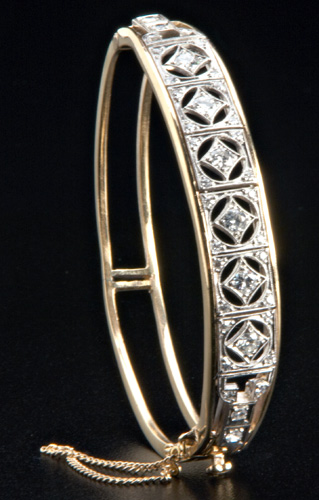 Appraisal: Diamond hinged bracelet in pt and k yg Central pt