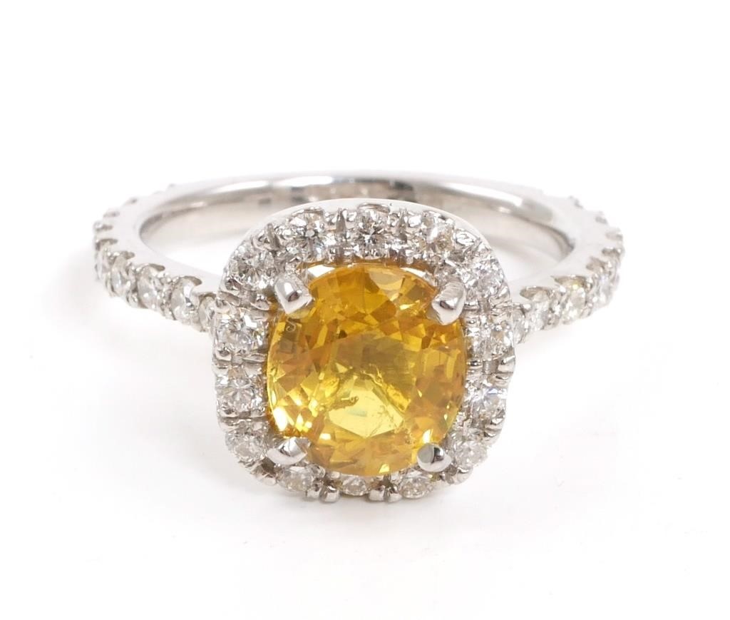 Appraisal: One electronically tested platinum ladies cast yellow sapphire and diamond