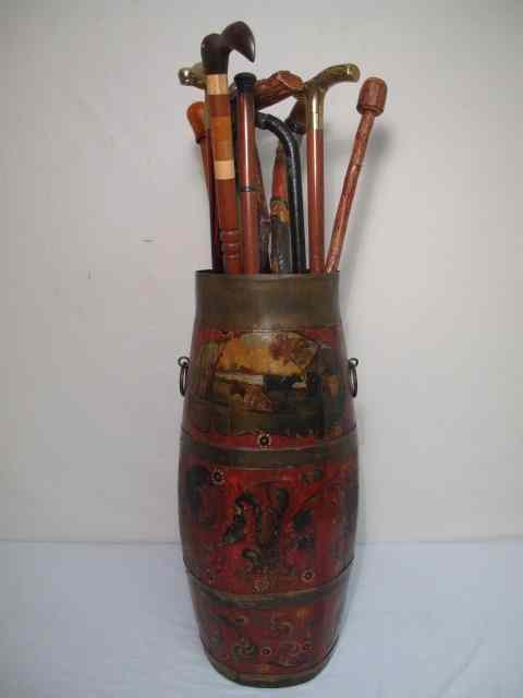 Appraisal: English style metal mounted barrel style umbrella stand holding assorted