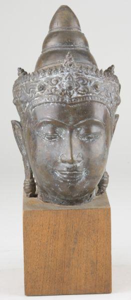 Appraisal: Cambodian Bronze Buddha Head hollow-cast on wooden base A few