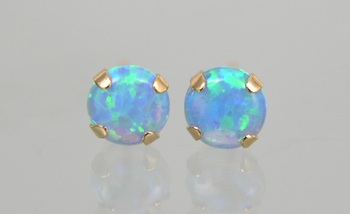 Appraisal: A Pair of Black Opal Gold Ear Studs A pair