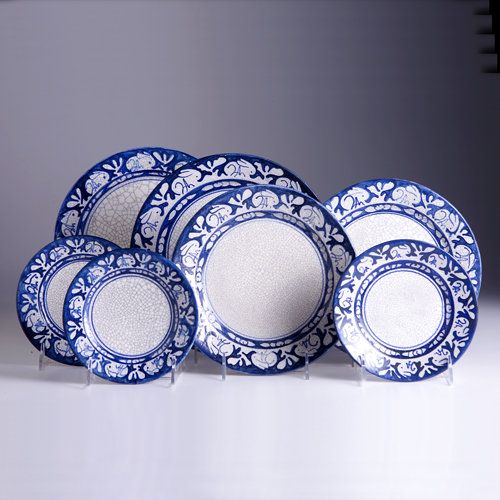 Appraisal: DEDHAM Seven assorted white crackleware plates in the Clockwise Rabbit