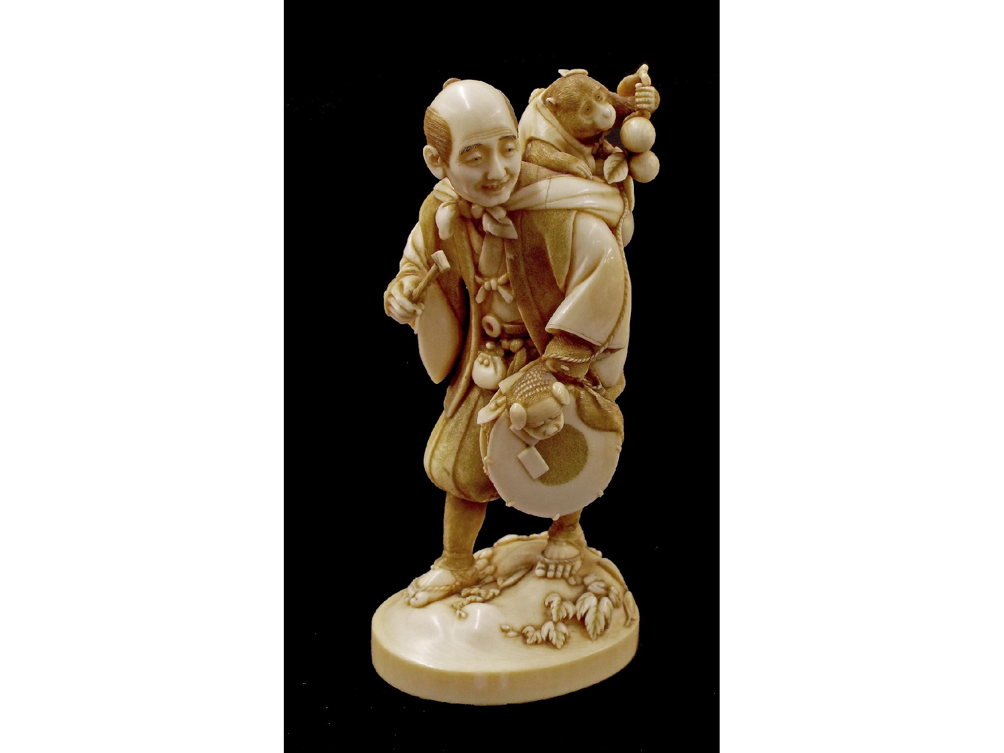 Appraisal: Japanese ivory okimono carved and modelled as a gentleman musician