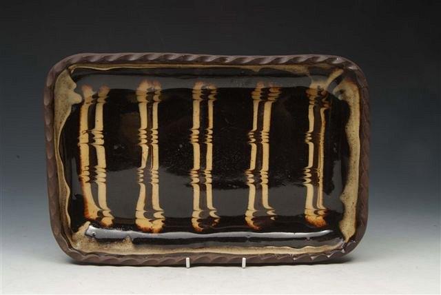 Appraisal: CHRIS HARRIES FOR WINCHCOMBE POTTERYA rectangular moulded dish with dragged