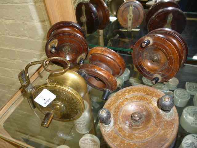 Appraisal: A MALLOCH'S PATENT BRASS REEL and four wooden centrepin reels