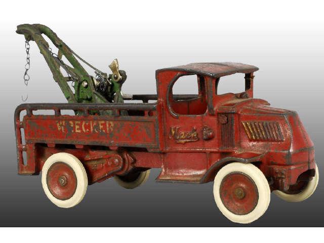 Appraisal: Cast Iron Red Arcade Mack Truck Toy Description The bed