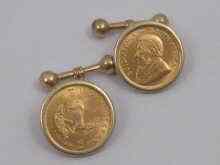 Appraisal: A pair of cufflinks with two krugerrands loose mounted in