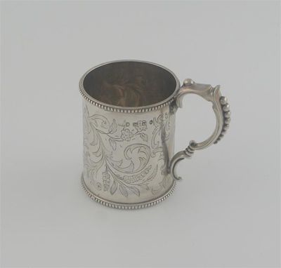 Appraisal: A Victorian small mug with bead borders floral engraving scrolling