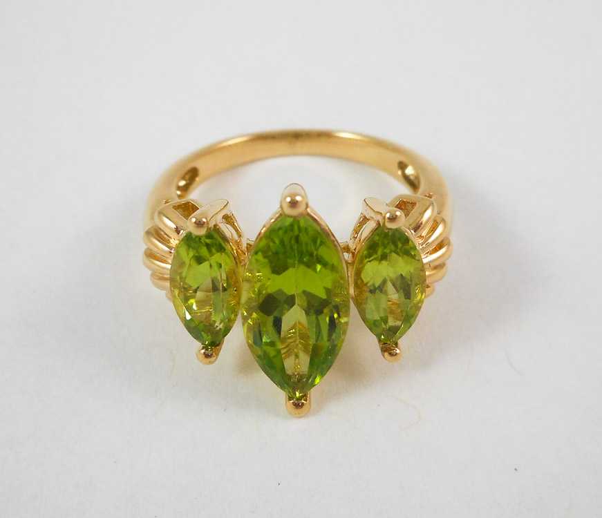 Appraisal: PERIDOT AND TEN KARAT YELLOW GOLD RING set with three