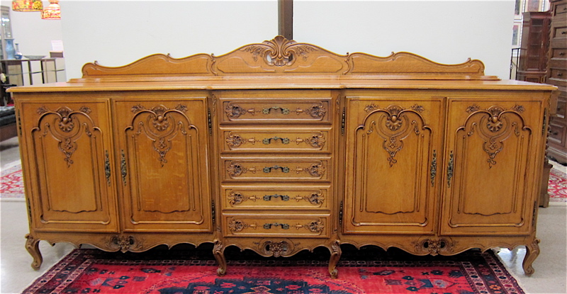 Appraisal: LOUIS XV STYLE CARVED OAK SIDEBOARD Continental th century featuring