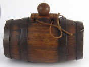 Appraisal: A small coopered oak brandy barrel with iron bands and