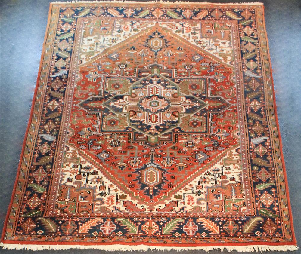 Appraisal: PERSIAN HERIZ RUG having a large stylized central medallion on