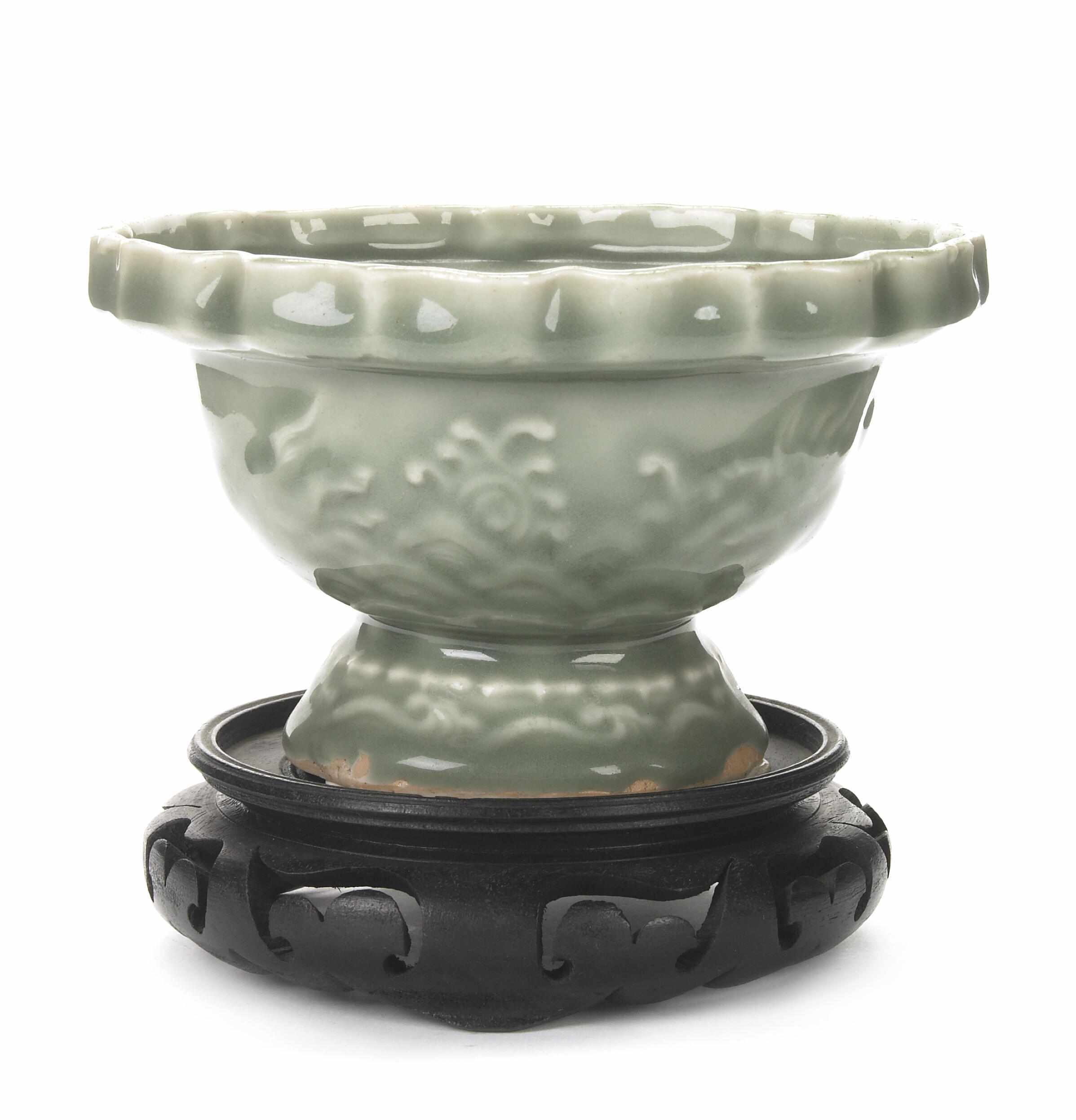 Appraisal: A Chinese molded celadon glazed ceramic foliate bowl height in