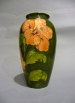 Appraisal: A Moorcroft green ground Golden Hibiscus shouldered form vase pre