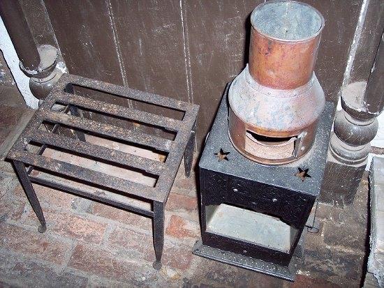 Appraisal: A Rippingilles Patent stove and an iron footman