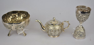 Appraisal: An Indian white metal miniature tea pot a lobed sugar