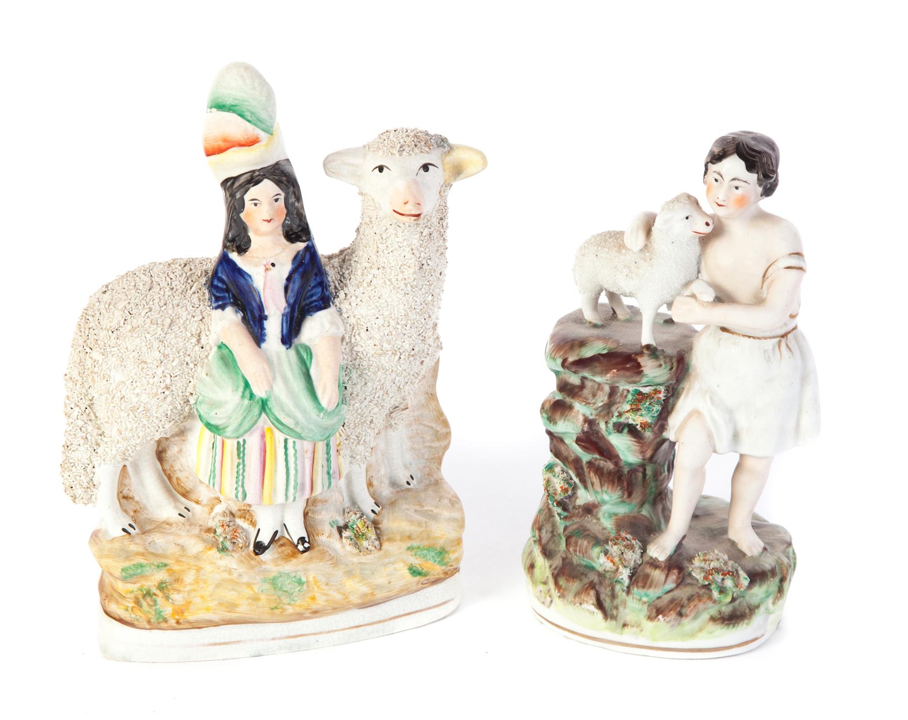 Appraisal: TWO STAFFORDSHIRE FIGURINES WITH LAMBS England nd half- th century