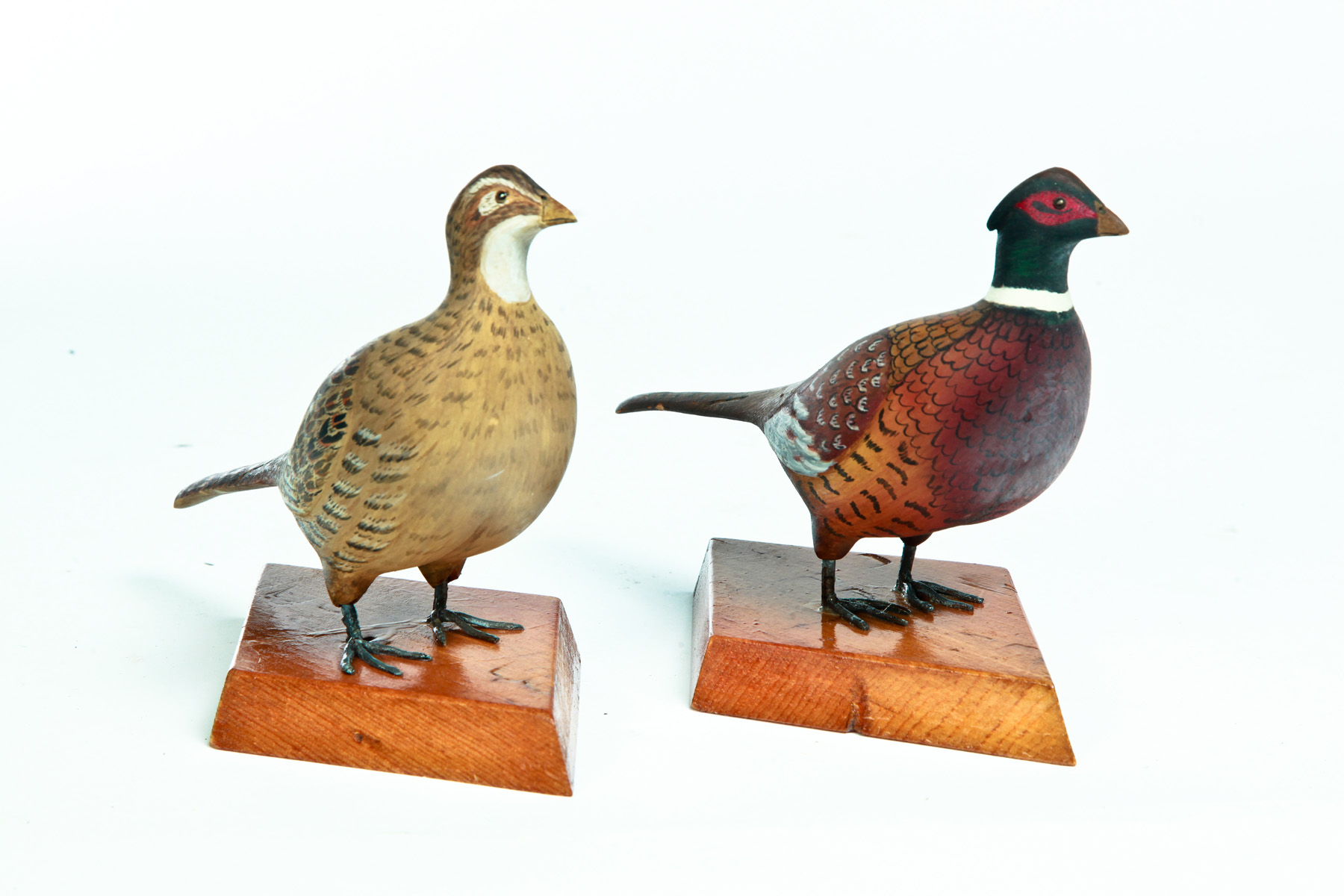 Appraisal: PAIR OF AMERICAN CARVED PHEASANTS Late th century Detailed original