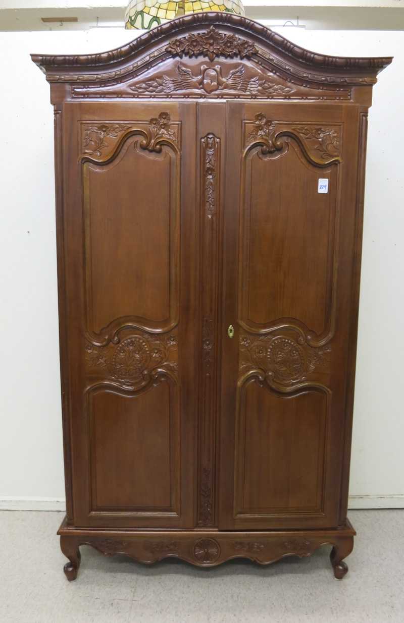 Appraisal: LOUIS XV STYLE CARVED MAHOGANY ARMOIRE having an arch top