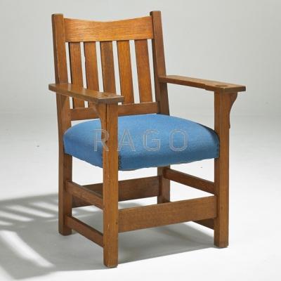 Appraisal: GUSTAV STICKLEY V-back armchair USA ca Quartersawn oak and tacked