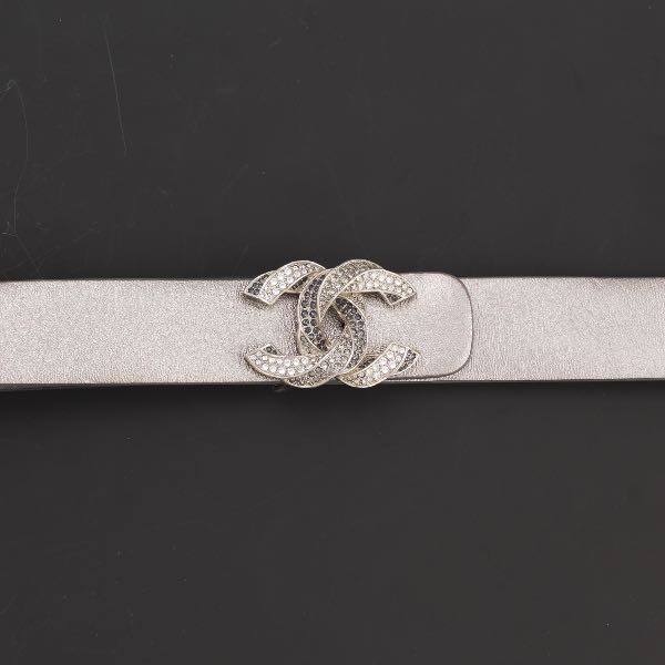 Appraisal: CHANEL INTERLOCKING CC SILVER BELT x Chanel metallic leather belt