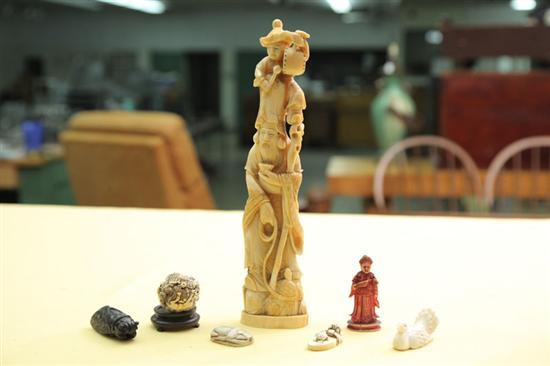 Appraisal: SEVEN ORIENTAL PIECES An ivory figure of a man with