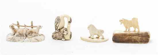 Appraisal: Four Carved Ivory Figural Groups depicting a monkey and a