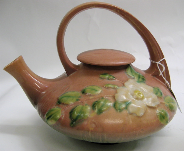 Appraisal: ROSEVILLE ART POTTERY TEAPOT AND LID White Rose pattern white