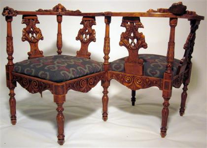 Appraisal: French carved walnut tete a tete chair The inverse S-shaped