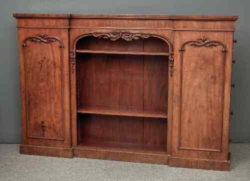 Appraisal: A Victorian figured mahogany break and open front dwarf bookcase