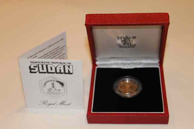 Appraisal: A SUDAN FIVE POUND PROOF GOLD COIN in original presentation