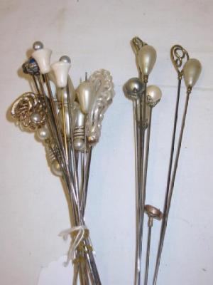 Appraisal: TWENTY EIGHT HAT PINS including fifteen faux mother of pearl